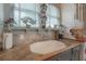 Kitchen sink featuring granite counters, stainless steel faucet and view from the window at 5114 N Branch Ave, Tampa, FL 33603