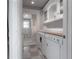 Laundry room with washer, dryer, and storage cabinets at 5114 N Branch Ave, Tampa, FL 33603