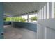 Inviting porch with exposed beams, blue siding, and views of the surrounding landscape at 5114 N Branch Ave, Tampa, FL 33603