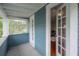 Open porch area with view to the home's interior, offering natural light and a welcoming atmosphere at 5114 N Branch Ave, Tampa, FL 33603