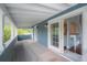 Covered porch with access to interior, offering a relaxing space to enjoy the outdoors at 5114 N Branch Ave, Tampa, FL 33603