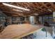 Spacious workshop featuring exposed rafters, ample lighting, shelving, and plenty of room for projects at 5114 N Branch Ave, Tampa, FL 33603