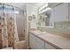 Well-lit bathroom with a shower-tub combo and a vanity at 5238 Vera St, Zephyrhills, FL 33542