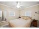 This bedroom offers neutral walls and a ceiling fan at 5238 Vera St, Zephyrhills, FL 33542