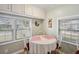 Sunlit dining area with seating for four and multiple windows at 5238 Vera St, Zephyrhills, FL 33542