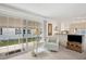 Bright living room with view of kitchen and large sliding doors to the outside at 5238 Vera St, Zephyrhills, FL 33542