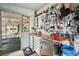 Organized workshop space with pegboard, counter, and storage cabinets for hobbies and projects at 5238 Vera St, Zephyrhills, FL 33542