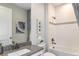 Bathroom featuring a combined bathtub and shower, with a vanity and artwork on the wall at 6206 Timberdale Ave, Wesley Chapel, FL 33545