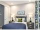 Cozy bedroom featuring a bedside table and a view of the closet and dresser at 6206 Timberdale Ave, Wesley Chapel, FL 33545