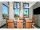Modern conference room features a large table with views of the outside and stylish pendant lighting at 6206 Timberdale Ave, Wesley Chapel, FL 33545