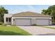 Charming single-Gathering home with a large two car garage and well maintained lawn at 6206 Timberdale Ave, Wesley Chapel, FL 33545