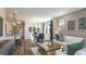 Spacious living room with modern furniture, view to kitchen, and a view to the yard at 6206 Timberdale Ave, Wesley Chapel, FL 33545