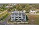 An aerial view showing modern townhomes with rooftop patios in a well-maintained community at 6207 64Th N Way, Pinellas Park, FL 33781