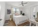 Inviting bedroom featuring natural light, modern art, and clean, minimalist furniture with stylish decor at 6207 64Th N Way, Pinellas Park, FL 33781
