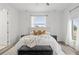Beautiful bedroom with a plush bed, soft lighting, and scenic window views at 6207 64Th N Way, Pinellas Park, FL 33781