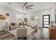 Inviting living room with large windows, stylish seating, and contemporary design elements for a comfortable atmosphere at 6207 64Th N Way, Pinellas Park, FL 33781