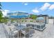 Inviting pool area with chic lounge furniture, elegant umbrellas, and a peaceful ambiance at 6207 64Th N Way, Pinellas Park, FL 33781