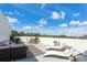 Expansive rooftop patio offering a variety of seating options and plenty of space for relaxation at 6207 64Th N Way, Pinellas Park, FL 33781