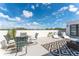 Relaxing rooftop patio with comfortable seating, a dining area, and scenic neighborhood views at 6207 64Th N Way, Pinellas Park, FL 33781