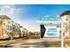 Street view of townhomes featuring modern architecture, lush trees, and a special financing sign at 6207 64Th N Way, Pinellas Park, FL 33781