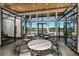 Bright lounge area with sleek furniture, marble table tops, and floor-to-ceiling windows showcasing outdoor views at 6212 Timberdale Ave, Wesley Chapel, FL 33545