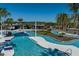 Stunning community pool area with winding waterways and lush landscaping on a sunny day at 6224 Timberdale Ave, Wesley Chapel, FL 33545