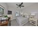 Relaxing bedroom showcasing soft neutral tones, natural lighting, and comfortable furnishings at 7328 Paradiso Dr, Apollo Beach, FL 33572