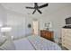 Comfortable bedroom with a ceiling fan and ample closet space at 7328 Paradiso Dr, Apollo Beach, FL 33572