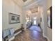 Bright entryway features wood-look tile flooring and a decorative mirror at 7328 Paradiso Dr, Apollo Beach, FL 33572