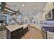 Kitchen featuring a large island with seating, stainless steel appliances, and ample counter space for food preparation at 7328 Paradiso Dr, Apollo Beach, FL 33572