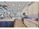Kitchen featuring white cabinets, modern appliances, and a functional layout for cooking and entertaining guests at 7328 Paradiso Dr, Apollo Beach, FL 33572