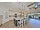 Kitchen with granite countertops and seating at the island, stainless steel appliances, and ample storage space at 7328 Paradiso Dr, Apollo Beach, FL 33572
