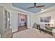 Bright office with a patterned rug, blue ceiling, and glass paneled french doors at 7328 Paradiso Dr, Apollo Beach, FL 33572