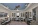 Home office featuring dual desks, blue ceiling, ceiling fan and neutral tones at 7328 Paradiso Dr, Apollo Beach, FL 33572