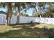 Spacious backyard featuring a privacy fence and a metal patio set at 7411 S Elliott St, Tampa, FL 33616