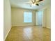 Bedroom featuring tile flooring, a ceiling fan, and a closet at 7411 S Elliott St, Tampa, FL 33616
