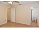Bedroom featuring tile flooring, neutral walls, and an en suite bathroom at 7411 S Elliott St, Tampa, FL 33616