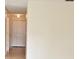 Hallway with tile flooring and a double-door closet for storage at 7411 S Elliott St, Tampa, FL 33616