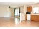 Bright and airy living room with tile floors and natural light from large windows at 7411 S Elliott St, Tampa, FL 33616