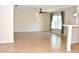 Expansive living room area, featuring tile floors, a ceiling fan, and views of the backyard at 7411 S Elliott St, Tampa, FL 33616