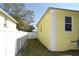 View of the side yard with a well-maintained privacy fence at 7411 S Elliott St, Tampa, FL 33616