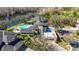 Stunning aerial view of waterfront home with pool and roof deck at 7425 Terrace River Dr, Temple Terrace, FL 33637
