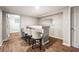 Finished basement bar area features custom shelving and modern stools for a great entertainment space at 7425 Terrace River Dr, Temple Terrace, FL 33637