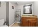 Small bathroom featuring a granite countertop, tile flooring and simple decor at 7425 Terrace River Dr, Temple Terrace, FL 33637