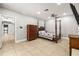 Bright, large bedroom with tile floors, ceiling fan, and four poster canopy bed at 7425 Terrace River Dr, Temple Terrace, FL 33637