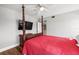 Bedroom with a four-poster bed and television at 7425 Terrace River Dr, Temple Terrace, FL 33637