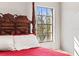 Bedroom with a four-poster bed and large window at 7425 Terrace River Dr, Temple Terrace, FL 33637