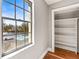 Bedroom window with a pool and lake view and small closet at 7425 Terrace River Dr, Temple Terrace, FL 33637