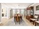 Elegant dining room with wood table, china cabinets, and view to the living room at 7425 Terrace River Dr, Temple Terrace, FL 33637