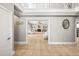 Bright foyer showcasing an open floor plan with large tile flooring and neutral paint at 7425 Terrace River Dr, Temple Terrace, FL 33637